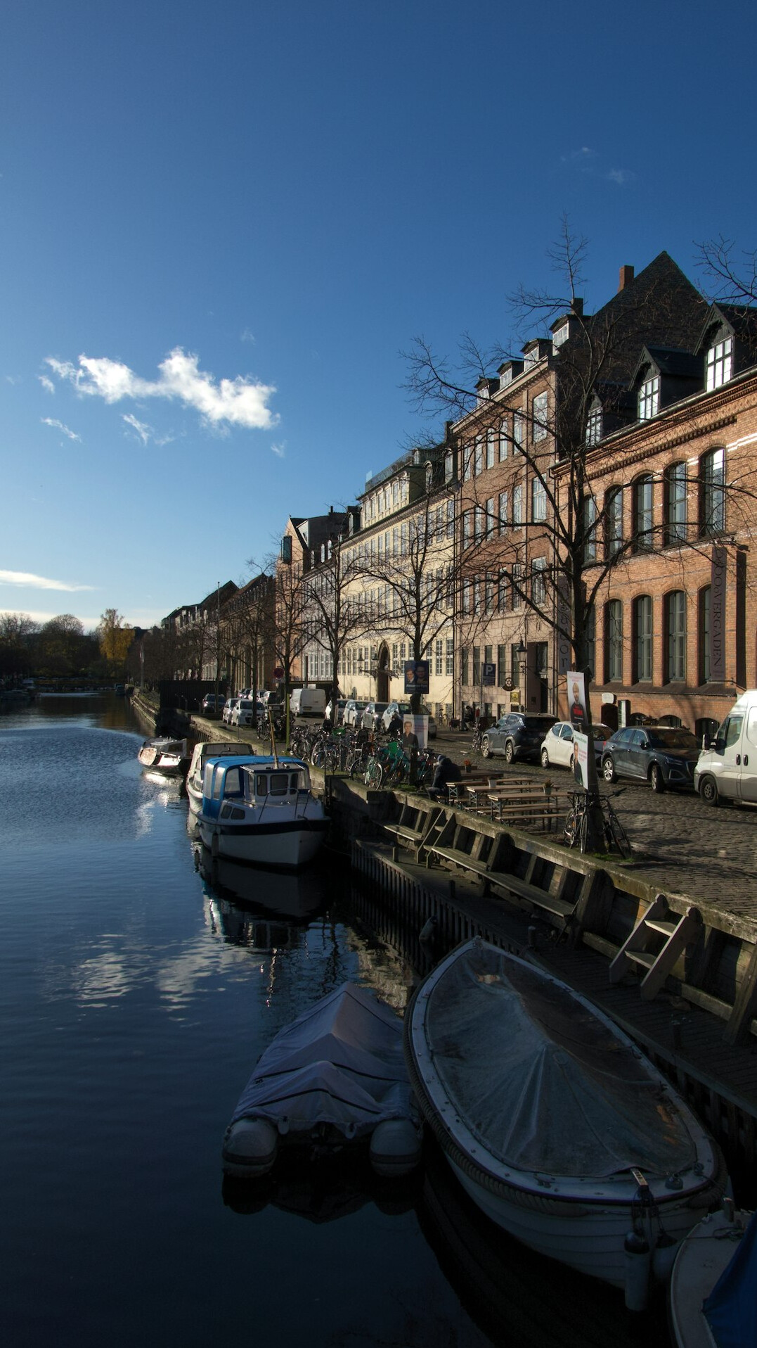 Bicycles parked along a Copenhagen canal street