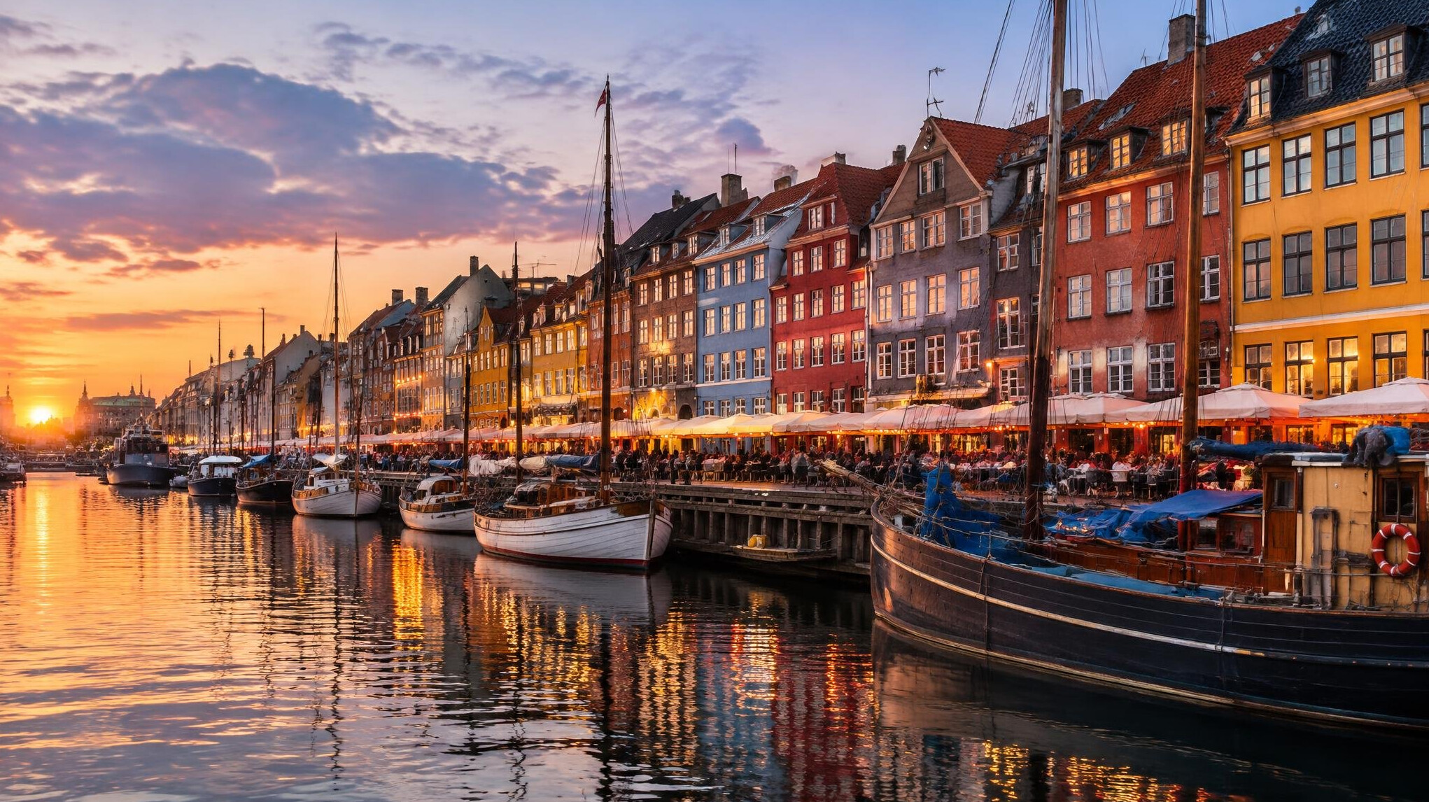 Colorful harbor houses in Nyhavn, Copenhagen at dusk
